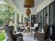 Relaxing covered porch with wicker chairs and views at 1456 Mcpherson Lndg, Johns Island, SC 29455