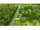 Aerial view of a home with well-maintained landscaping and a long concrete driveway at 1617 Southwick Dr, Johns Island, SC 29455