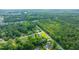 An aerial view of neighborhood homes surrounded by lush green trees and foliage at 1617 Southwick Dr, Johns Island, SC 29455