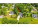 Aerial view of a home with well-maintained landscaping, a gray roof, and a long driveway at 1617 Southwick Dr, Johns Island, SC 29455