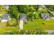 An aerial view of the property, showing its well-manicured lawn, gray roof, and attached garage at 1617 Southwick Dr, Johns Island, SC 29455