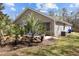 The house has a patio surrounded by a yard with beautiful tropical landscaping for a serene backyard oasis at 1617 Southwick Dr, Johns Island, SC 29455