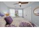 Bedroom featuring ceiling fan, carpet, and built in storage closet with decorative window mirror at 1617 Southwick Dr, Johns Island, SC 29455