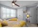 Bedroom boasting decorative ceiling fan, carpet, and double closet doors, for ample storage at 1617 Southwick Dr, Johns Island, SC 29455