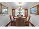 Formal dining room with decoratively framed mirrors and paintings at 1617 Southwick Dr, Johns Island, SC 29455