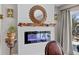Modern fireplace with a decorative mantel and mirror, creating a cozy and stylish focal point at 1617 Southwick Dr, Johns Island, SC 29455