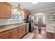 Kitchen features stainless steel appliances and a view into the dining room at 1617 Southwick Dr, Johns Island, SC 29455