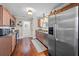Spacious kitchen with wood floors features stainless steel appliances and lots of cabinet space at 1617 Southwick Dr, Johns Island, SC 29455