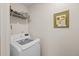 Laundry room featuring a modern washing machine, ample storage shelves, and a bright, clean space at 1617 Southwick Dr, Johns Island, SC 29455