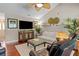 Comfortable living room with plush seating, a ceiling fan, and large windows for natural light at 1617 Southwick Dr, Johns Island, SC 29455