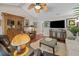 Spacious living room with decorative cabinet, comfortable seating, and hardwood floors at 1617 Southwick Dr, Johns Island, SC 29455