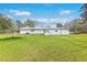 Lush backyard featuring a trampoline, shed, and ample green space perfect for outdoor recreation and entertainment at 1644 Cooper Store Rd, Moncks Corner, SC 29461