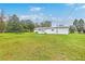 Expansive backyard showcasing lush green grass, a storage shed, and plenty of space for outdoor activities and relaxation at 1644 Cooper Store Rd, Moncks Corner, SC 29461