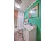 Bathroom with white vanity, toilet, shower with curtain, and unique green wall at 1644 Cooper Store Rd, Moncks Corner, SC 29461