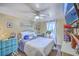 Comfortable bedroom features a ceiling fan, natural light, and calming decor at 1644 Cooper Store Rd, Moncks Corner, SC 29461
