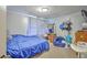 Functional bedroom with a large bed, desk area, and comfortable seating at 1644 Cooper Store Rd, Moncks Corner, SC 29461