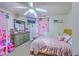 bedroom featuring a pink-themed design, ceiling fan, and a mounted TV at 1644 Cooper Store Rd, Moncks Corner, SC 29461