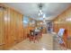 Cozy dining room featuring a wooden table set, wood paneled walls, and natural light at 1644 Cooper Store Rd, Moncks Corner, SC 29461