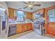 Traditional kitchen features wood cabinets, stainless steel appliances, and wood-look flooring at 1644 Cooper Store Rd, Moncks Corner, SC 29461