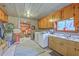 Utility area with washer, dryer, storage cabinets, and sink; offering practicality and convenience at 1644 Cooper Store Rd, Moncks Corner, SC 29461