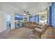 Living room featuring comfortable seating, a ceiling fan, TV and natural light, creating an inviting atmosphere at 1644 Cooper Store Rd, Moncks Corner, SC 29461