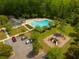 Aerial view of community pool, clubhouse, playground, and parking for neighborhood residents at 166 Pavilion St, Summerville, SC 29483