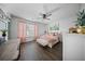 Bright bedroom with stylish décor including a ceiling fan and decorative pink accents at 166 Pavilion St, Summerville, SC 29483