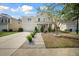 Inviting two-story home with a manicured lawn, stone pathway and charming curb appeal on a sunny day at 166 Pavilion St, Summerville, SC 29483