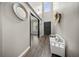 Bright foyer showcasing wood floors, a decorative mirror, and a comfortable bench at 166 Pavilion St, Summerville, SC 29483