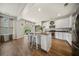 Bright eat-in kitchen features an island with bar seating and modern stainless steel appliances at 166 Pavilion St, Summerville, SC 29483