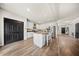 Open kitchen with granite countertops, white cabinetry, stainless appliances, and barstool seating at 166 Pavilion St, Summerville, SC 29483