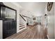 Open living room with hardwood floors, stairs and butler's pantry at 166 Pavilion St, Summerville, SC 29483