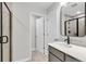 Bathroom featuring modern gray vanity, sleek fixtures, and tiled shower with glass door at 169 Cantona Dr, Summerville, SC 29483