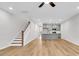 Spacious living room with stairs, kitchen island, and modern ceiling fan at 169 Cantona Dr, Summerville, SC 29483