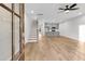 Open-concept living room featuring hardwood floors, neutral paint, and a view of the modern kitchen at 169 Cantona Dr, Summerville, SC 29483