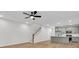 Modern kitchen, stairs, and living room space for a contemporary open floor plan at 169 Cantona Dr, Summerville, SC 29483