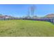 Expansive backyard featuring a well-maintained lawn enclosed by a dark wood privacy fence at 175 Darby Meadow Ln, Ridgeville, SC 29472