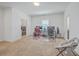 Spacious bedroom with neutral carpet and a comfortable seating area for gaming and relaxation at 175 Darby Meadow Ln, Ridgeville, SC 29472
