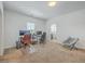 Spacious bedroom with neutral carpet and a comfortable seating area for gaming and relaxation at 175 Darby Meadow Ln, Ridgeville, SC 29472