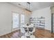 Modern dining area featuring a round table with stylish chairs and a contemporary light fixture at 175 Darby Meadow Ln, Ridgeville, SC 29472