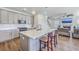 Beautiful kitchen with gray cabinets, quartz countertops, stainless steel appliances and opens to the living room at 175 Darby Meadow Ln, Ridgeville, SC 29472