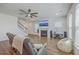 Bright living room with hardwood floors, a fireplace, large windows, and comfortable seating at 175 Darby Meadow Ln, Ridgeville, SC 29472