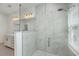 Luxurious glass-enclosed shower with white marble-style tile, and a rain shower head at 175 Darby Meadow Ln, Ridgeville, SC 29472