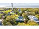 Expansive aerial view of the property, showcasing its lush landscape and proximity to the historic lighthouse at 1808 Ion Ave, Sullivans Island, SC 29482