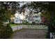 Private backyard with lush greenery and a towering structure in the background, creating a serene, secluded setting at 1808 Ion Ave, Sullivans Island, SC 29482