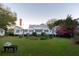 Spacious backyard featuring a lush lawn and mature trees, offering a serene and private outdoor retreat at 1808 Ion Ave, Sullivans Island, SC 29482