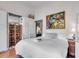 Inviting bedroom with a decorative folding screen, white linens, and unique artwork at 1808 Ion Ave, Sullivans Island, SC 29482