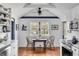 Charming dining area with wood floors, exposed beams, and a small table perfect for intimate meals at 1808 Ion Ave, Sullivans Island, SC 29482