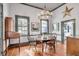 Dining room with hardwood floors, a wooden table, and a chandelier at 1808 Ion Ave, Sullivans Island, SC 29482