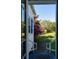 Exterior view from the doorway, showing a beautiful garden and well-manicured lawn at 1808 Ion Ave, Sullivans Island, SC 29482